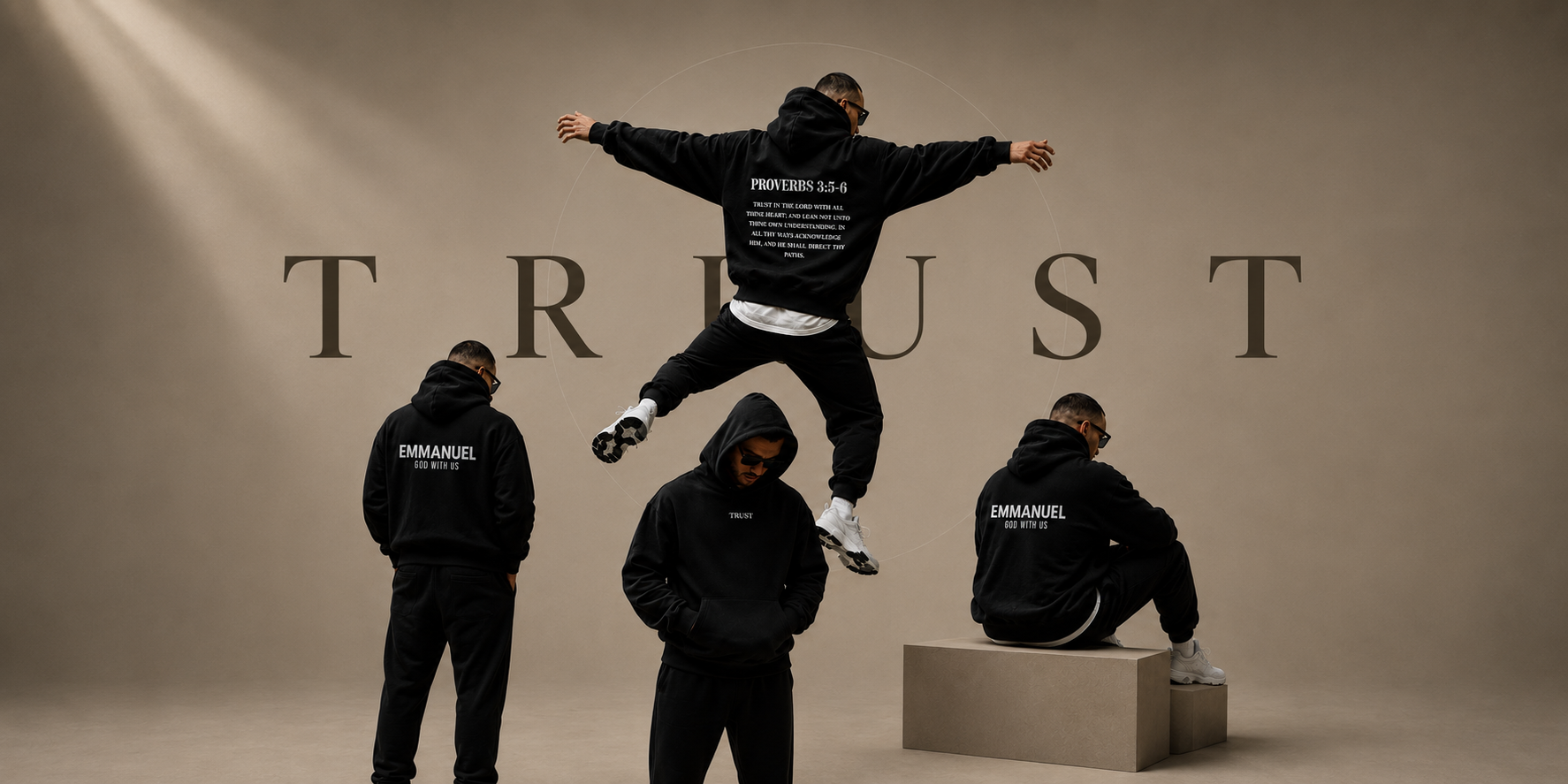 Four models wearing black EVERREMINDR scripture hoodies in front of the word TRUST